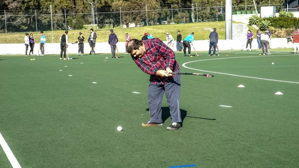 Participant playing golf.